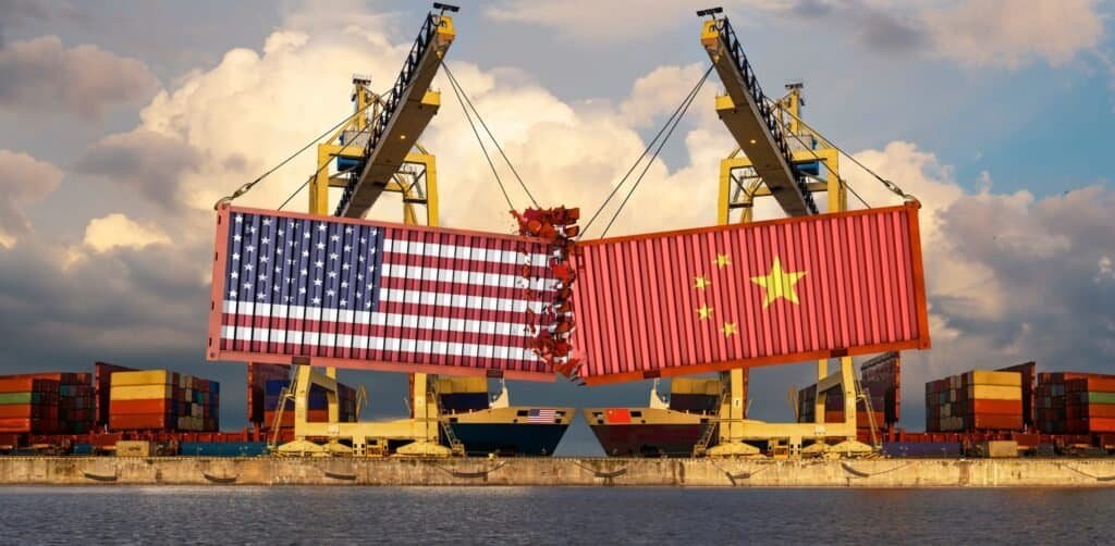 Shipping containers marked US and China flags symbolizing trade war